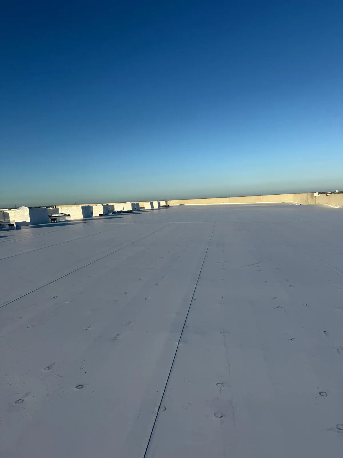 Commercial roof at sunset